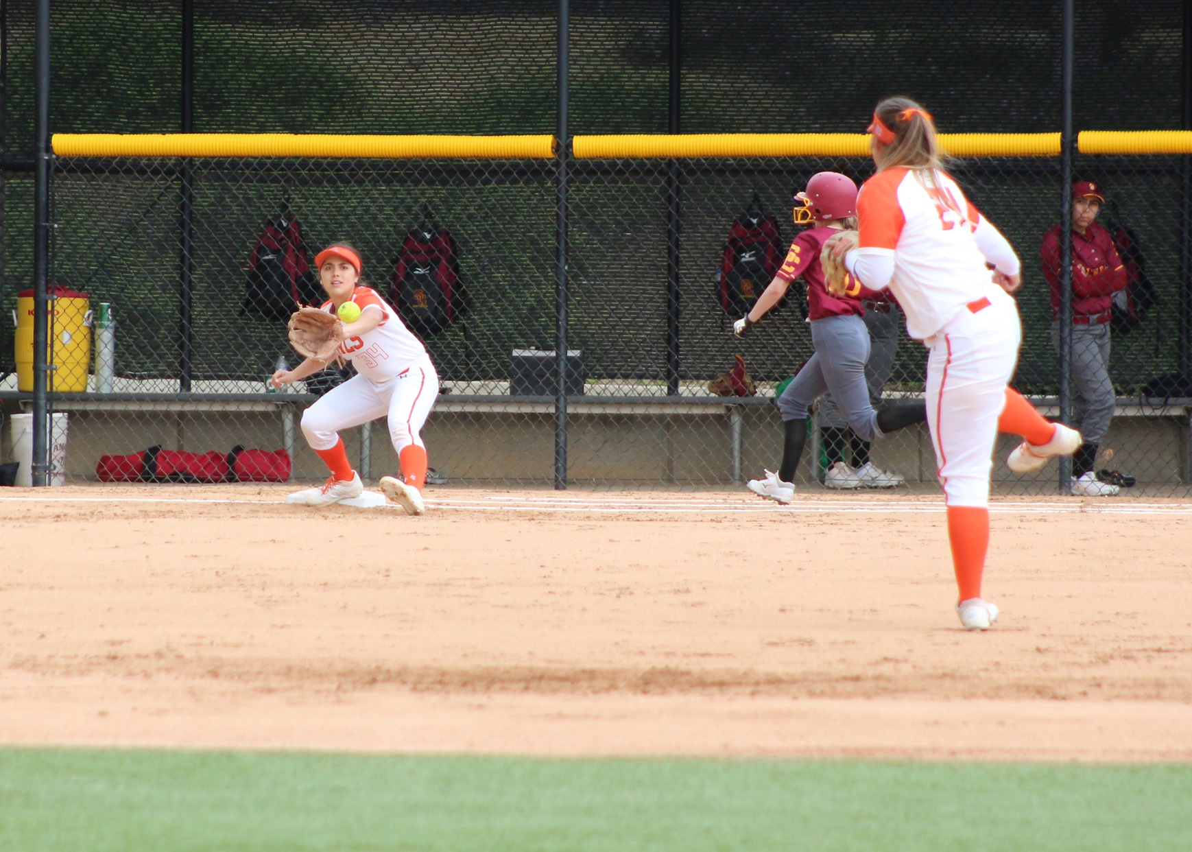 Alex Valenzuela stretches at 1st on the throw from Katie Kempton to get the runner. Image: Treyvon Watts-Hale