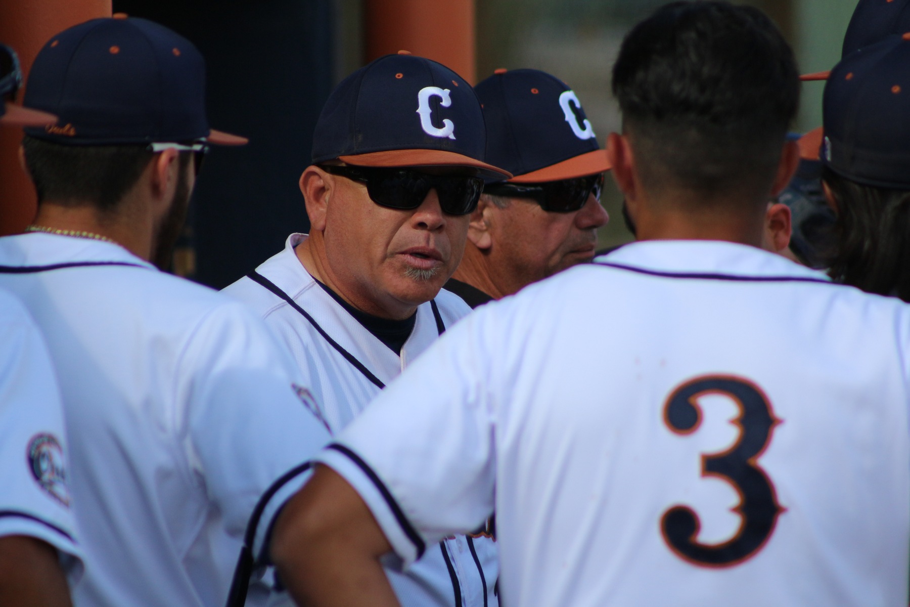 Head Coach Steve Gomez motivating his guys in the dugout.