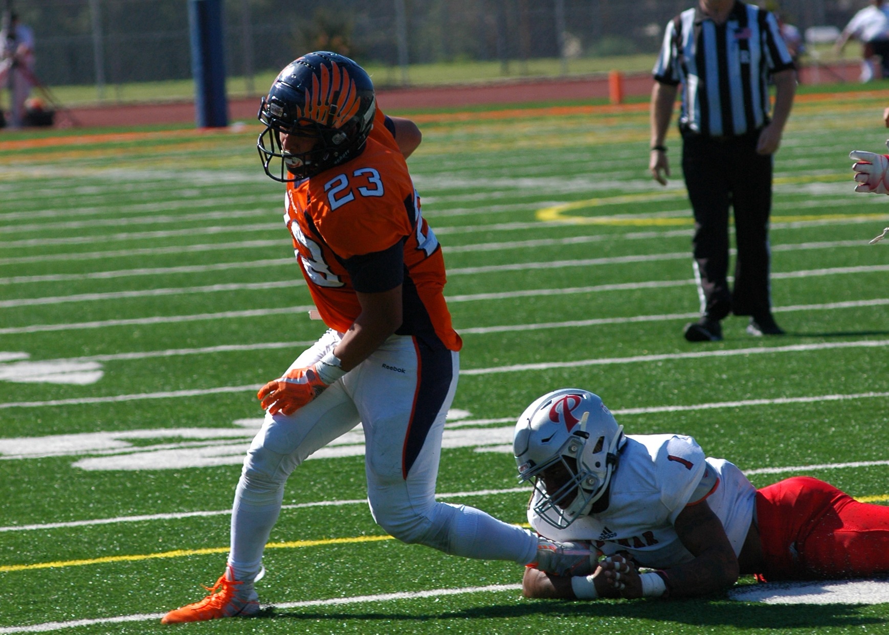 Running Back Sal Tovar breaks free from an opponent defender in action earlier this fall. Image: Thomas Garcia