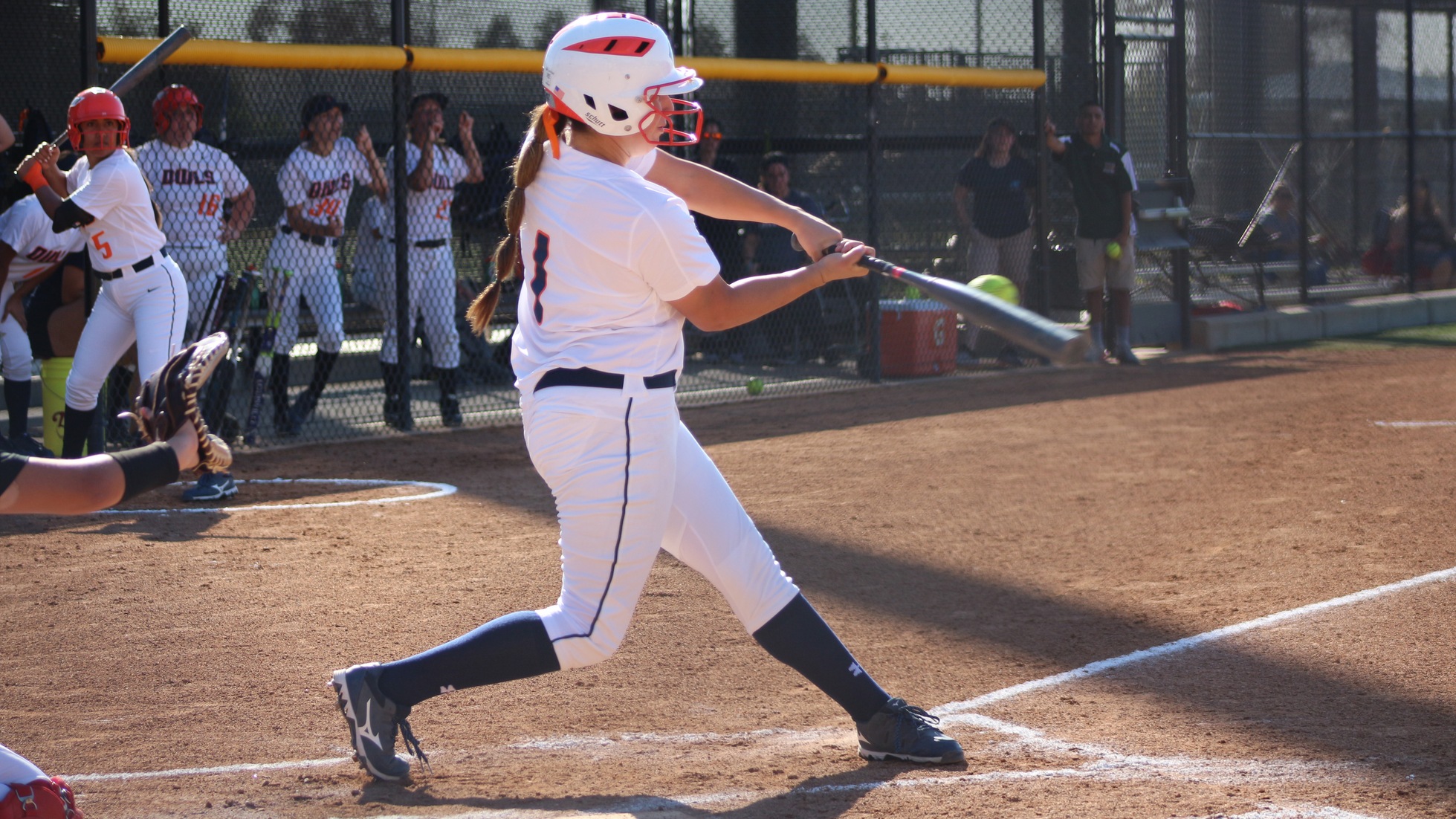 Alexis Cordero hits the ball for the Owls. Photo by: Brianna Jara.