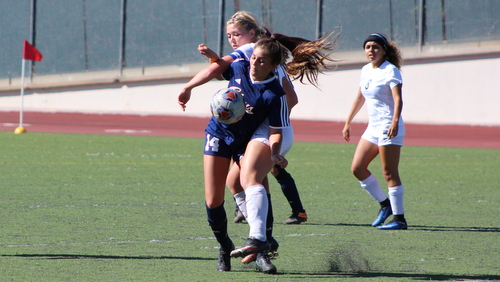 Freshman Megan Cabrera, seen her battling for the ball, recorded her first assist in Citrus' loss to Fullerton.