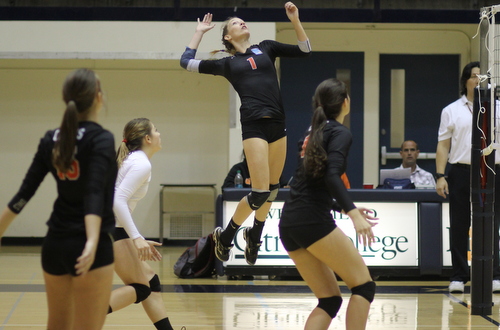 Sophomore Kyla White (#1) had a match high in kills and digs. Photo By: Robert Lopez