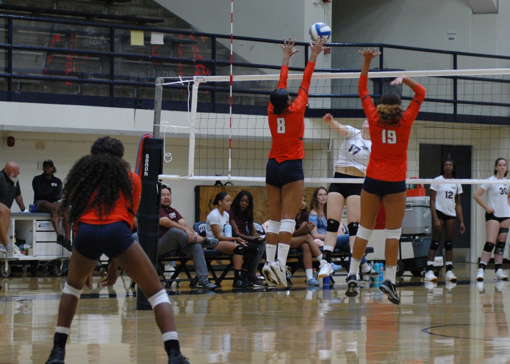 Summer Edington (8) and Danielle Rogers (19)  block against the right side attack. Image: Thomas Garcia