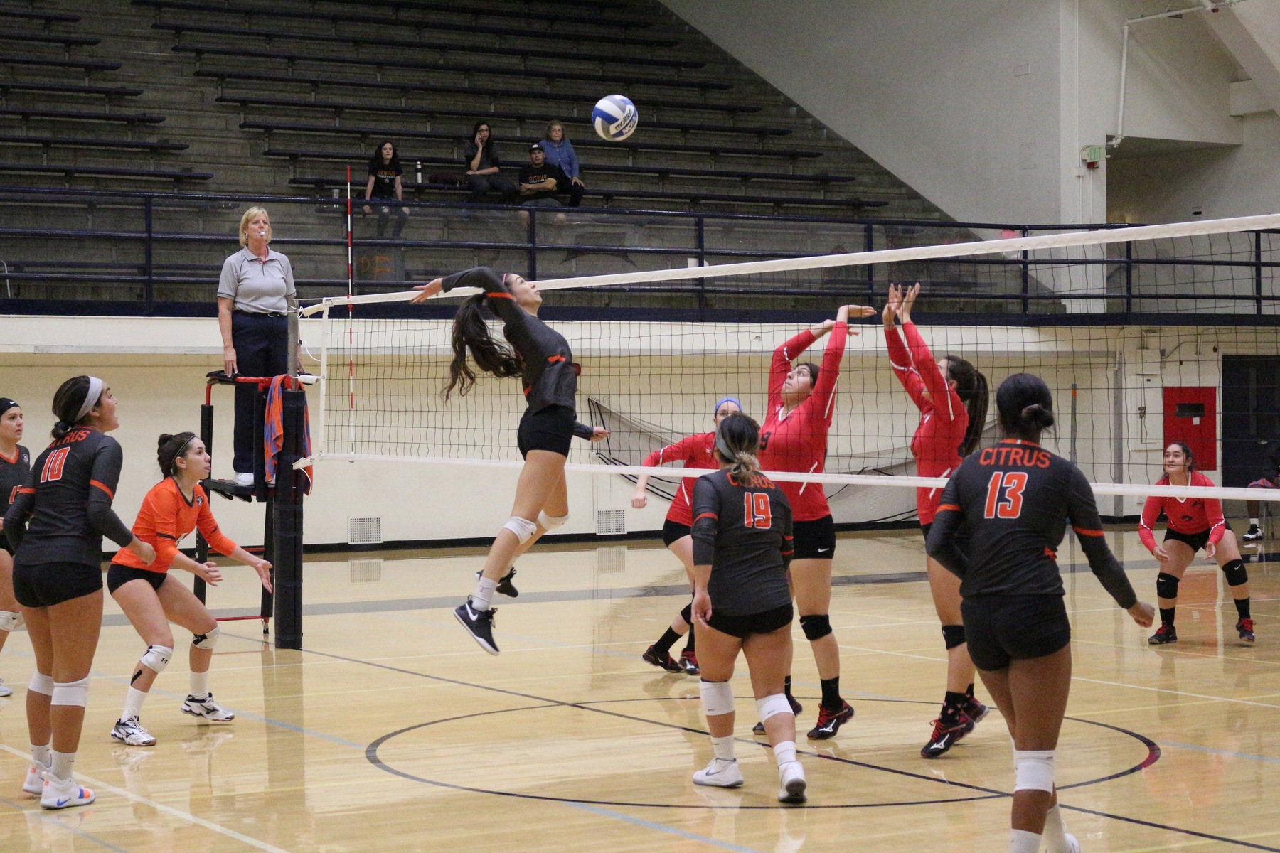 Middle Blocker Iris Bernal launches for a quick set from Julianna Aceituno. Image: Treyvon Watts-Hale