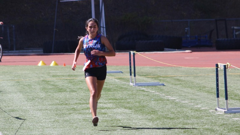 Adrianna Torres puts in a kick to take fifth at the Canyons Cross Country Invite.